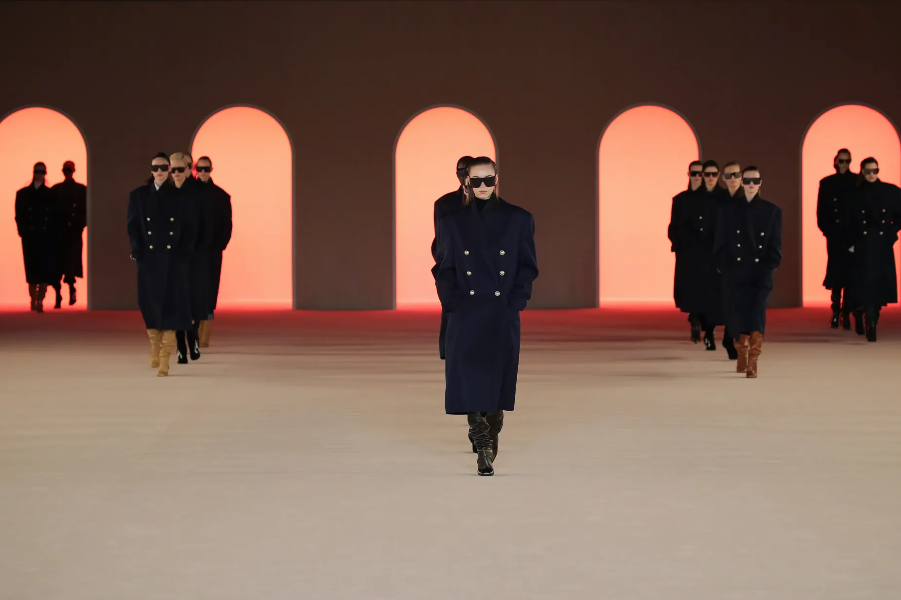 Balmain runway with models framed by illuminated arches
